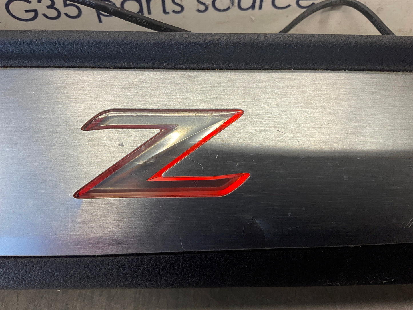 2012 Nissan 370Z Passenger Illuminated Door Threshold Kick Plate OEM 24BDME7 - On Point Parts Inc
